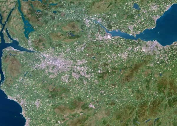 Satellite image showing Edinburgh and Glasgow creeping towards each other