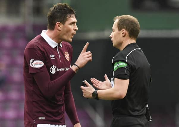 Kyle Lafferty was booked by Willie Collum in Hearts' win over Celtic. Pic: SNS