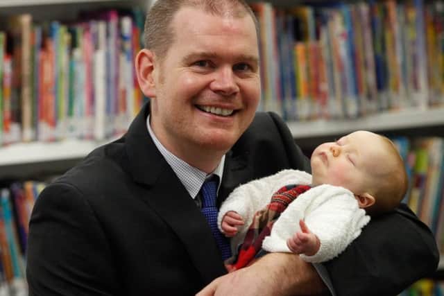 Alan Ferrier, Head of Demographic Statistics at the National Records Of Scotland with his 2-month-old daughter Megan. Picture: Contributed