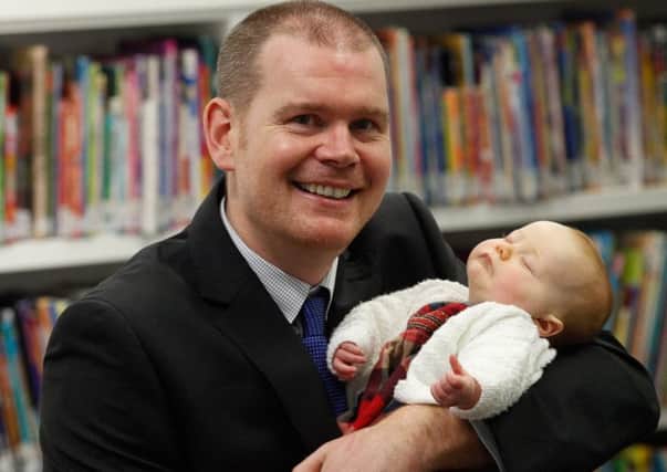 Alan Ferrier, Head of Demographic Statistics at the National Records Of Scotland with his 2-month-old daughter Megan. Picture: Contributed