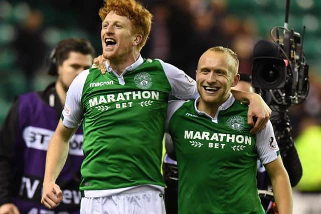 Simon Murray and Dylan McGeouch celebrate Hibs' derby win over Hearts in October
