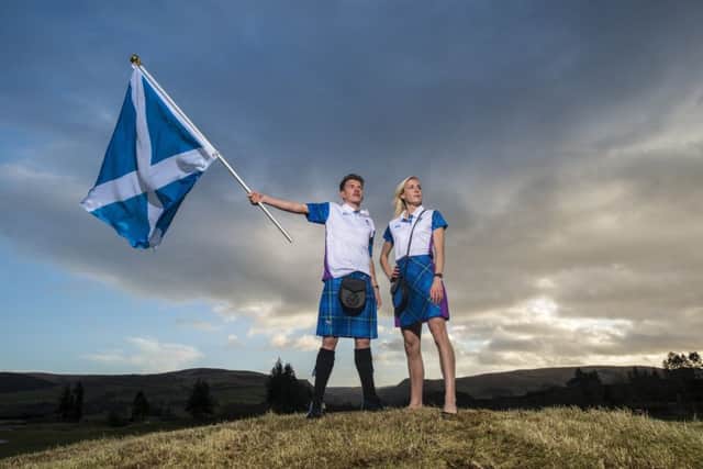 Lynsey Sharp launches a bespoke tartan for the Commonwealth Games alongside her boyfriend and fellow Scots runner Andrew Butchart. Pic: SNS