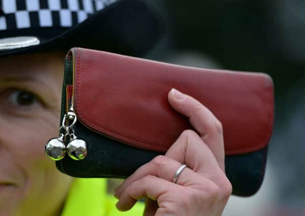 The woman told officers she was 'too busy' to collect the purse. Picture: TSPL