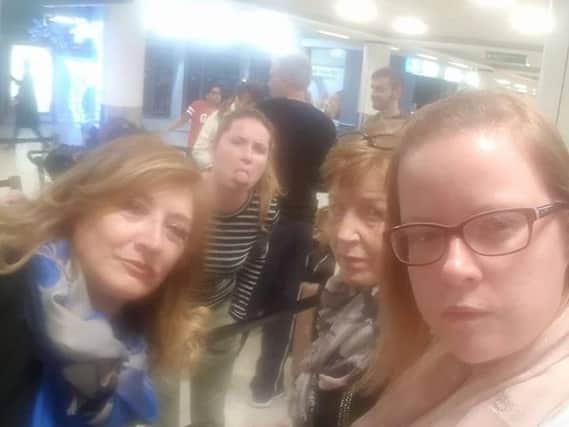Lesley Ballantyne and fellow passengers queuing to check in last night, 36 hours after their flight should have taken off. Picture: Lesley Ballantyne