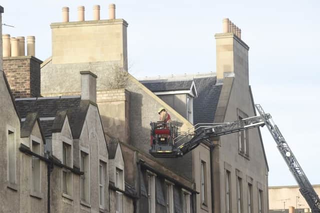 Scottish Fire and Rescue service personnel inspected the roof.  Picture; TSPL/Greg Macvean