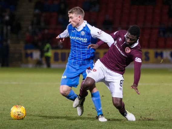 Hearts' Prince Buaben challenges David Wotherspoon of St Johnstone at McDiarmid Park