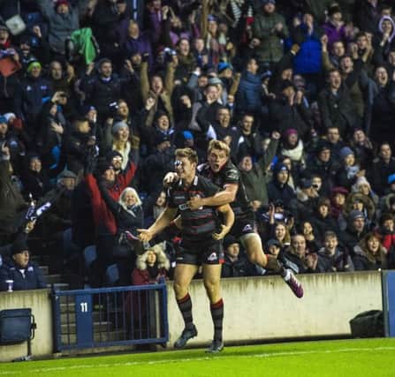 Edinburgh's Chris Dean (left) celebrates his winning try with Nathan Fowles. Pic: SNS