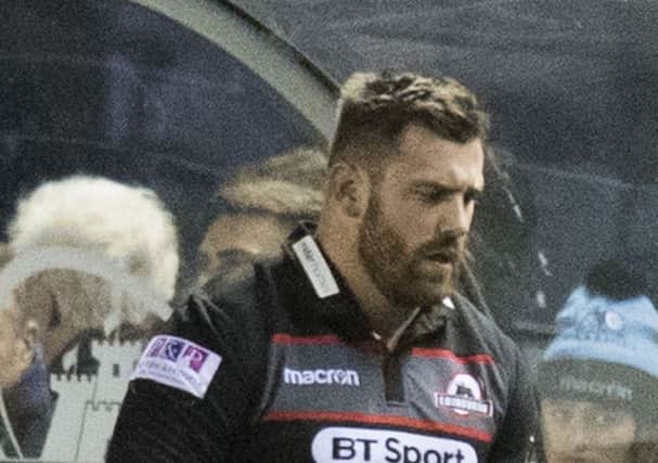 Simon Berghan heads to the tunnel after being shown a red card