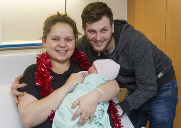 Mum, Amy Confortola and dad Kenny Lindsay with baby Lucilia. Picture: Ian Rutherford