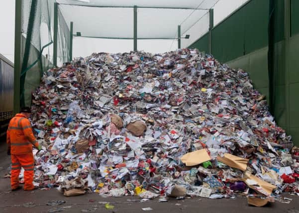 Rather than recycling where possible, many simply throw their wrapping paper, packaging, old Christmas cards and leftover food out with the rubbish. Picture: SWNS