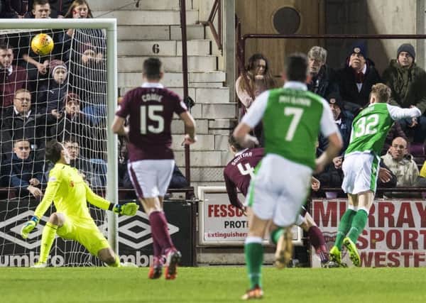 Hibs striker Oli Shaw's strike hit the bar before bouncing down. The officials failed to spot it had crossed the line