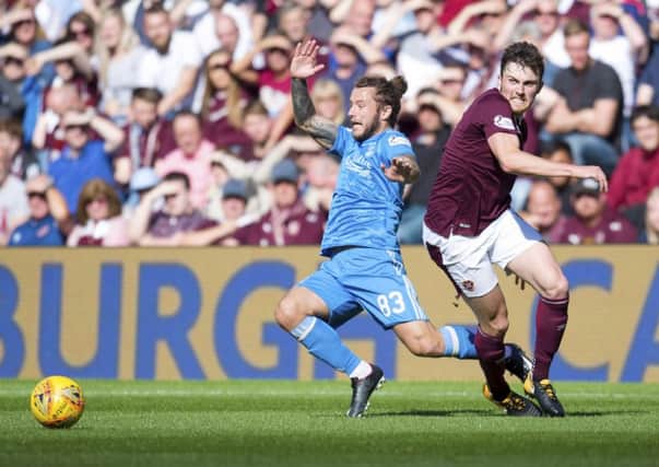 John Souttar helped Hearts keep a clean sheet against Aberdeen last time the teams met. Now he wants to post a victory. Pic: SNS