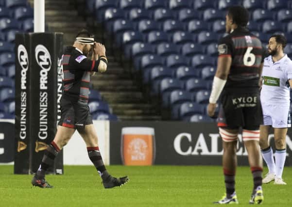 Edinburgh's Simon Berghan walks off after being shown a red card against Glasgow. Picture: Ross Parker/SNS