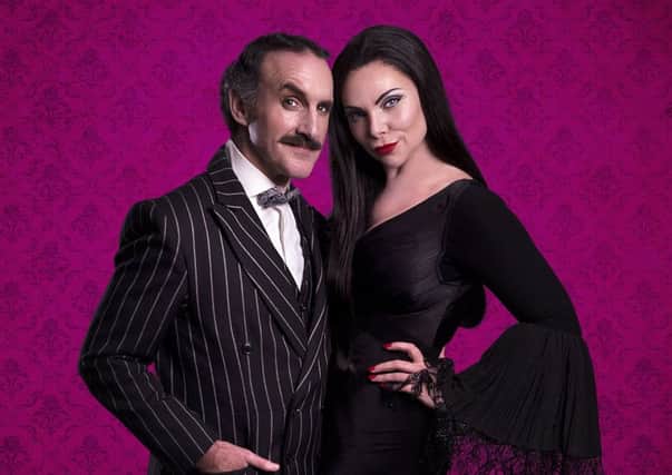 Cameron Blakely as Gomez and Sam Womack as Morticia