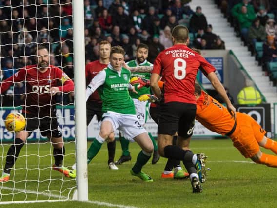 Oli Shaw is first to the ball after Killie goalkeeper Jamie MacDonald's blunder to haul Hibs level