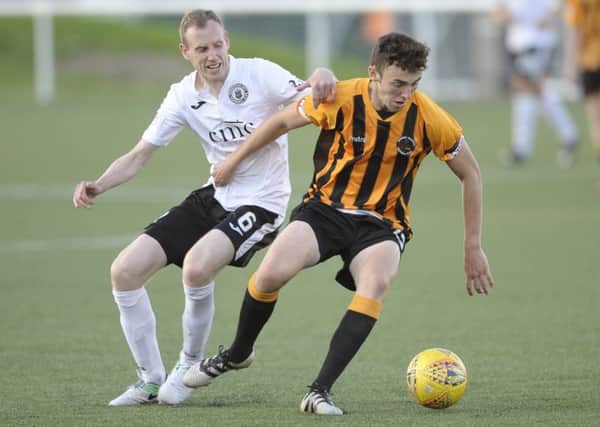 Andrew Irving battles with Edinburgh City's Marc Laird earlier this season. Pic: Andy Irving