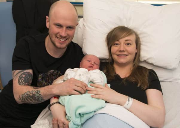 New parents Colin Graham and  Stacey Glancy from Drylaw introduce baby Travis to the world. Picture: TSPL