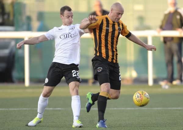 Edinburgh City have bolstered their defence with the signing of Pat Scullion, right