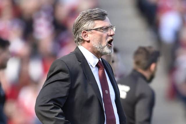 Craig Levein stepped back into the dugout to replace Cathro