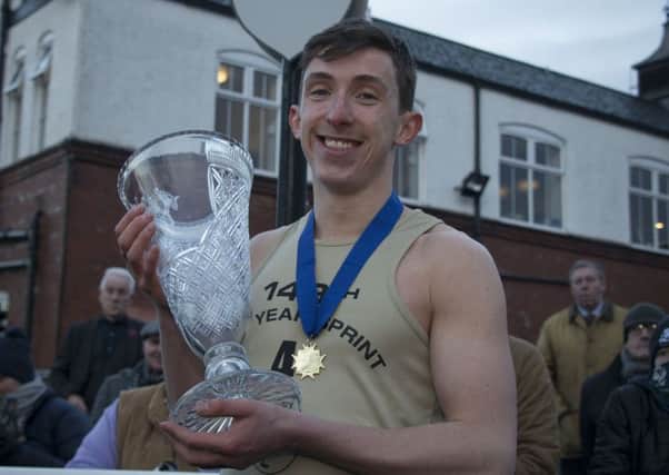 Calum McWilliam shows off the New Year Sprint crystal trophy. Pic: Andrew O'Brien
