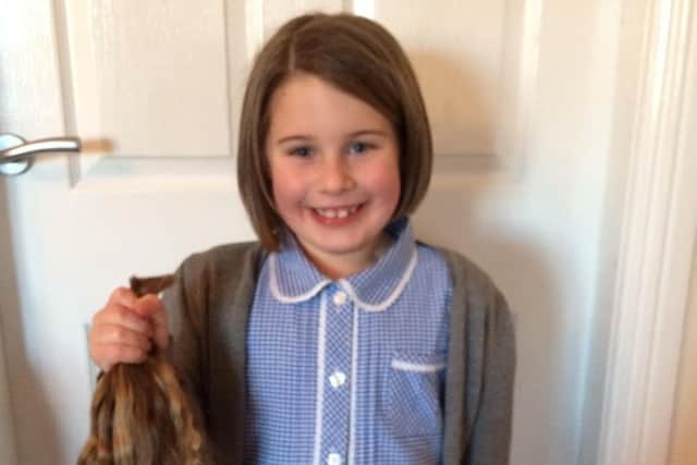 Lilly had ponytails of 11.5 inches chopped off so that she can help children with cancer. Picture: contributed