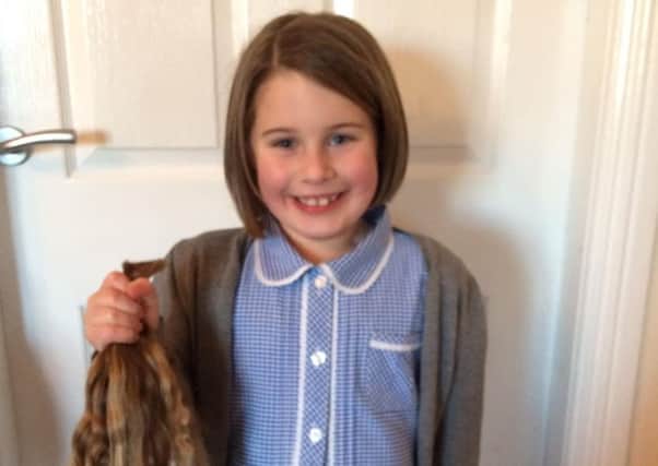 Lilly had ponytails of 11.5 inches chopped off so that she can help children with cancer. Picture: contributed