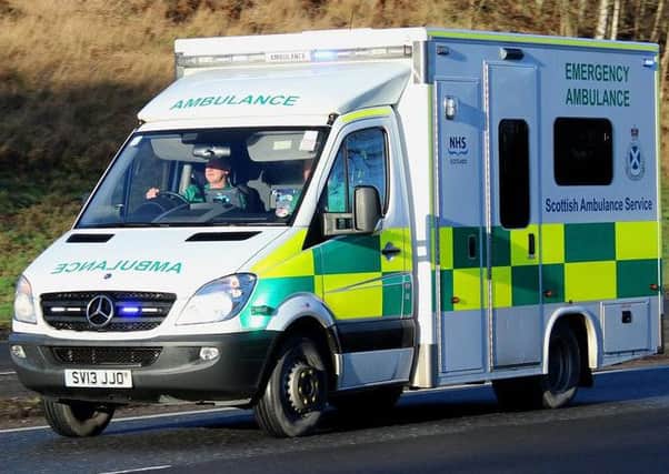 A woman has been arrested after an abusive note was lfet on an ambulance.