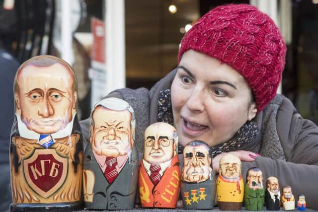 Stephanie Reeves with her Â£15 Russian Dolls of Russian politicians. Picture: SWNS