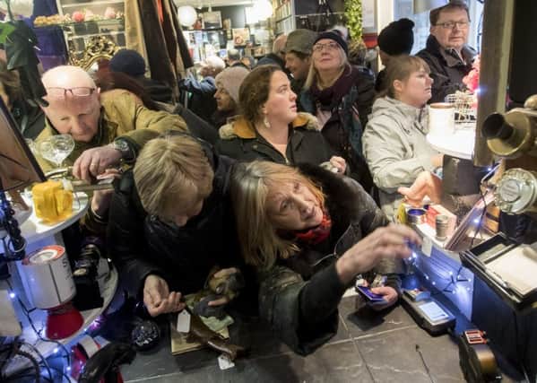 Shoppers rush to grab a bargain. Pictures: SWNS