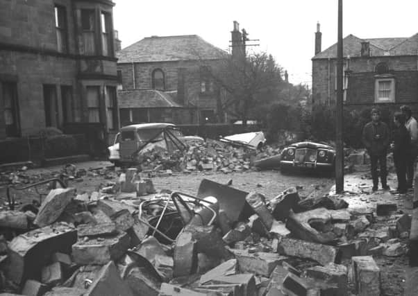 Three cars crushed by fallen masonry in Bruntsfield Gardens after the January gales in Edinburgh in 1968. Picture: TSPL