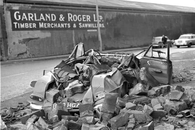 Car outside Garland & Roger sawmill was crushed by masonry after the January gales in Edinburgh in 1968. Picture: TSPL
