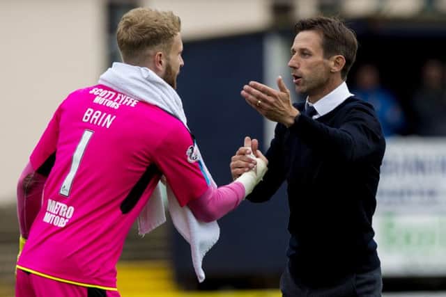 Dundee boss Neil McCann and Bain during more cordial times between the two. Pic: SNS