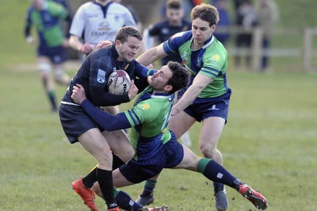 Max McFarland of Currie and Grant McConnell of Boroughmuir clash at Malleny Park. Pic: Neil Hanna