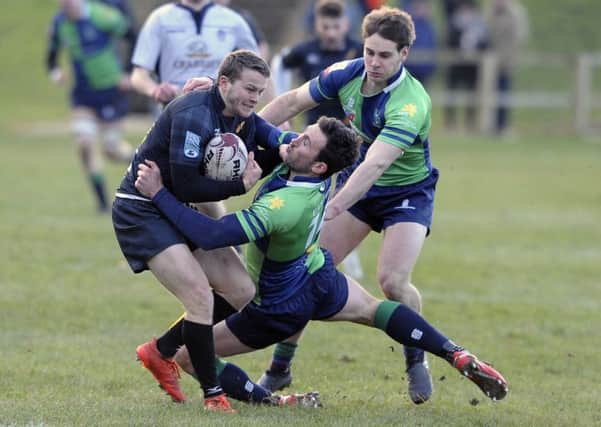 Max McFarland of Currie and Grant McConnell of Boroughmuir clash at Malleny Park. Pic: Neil Hanna