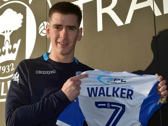 Jamie Walker poses with his Wigan shirt after arriving from Hearts. Pic: Wigan Athletic FC