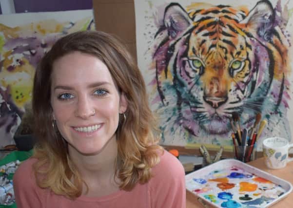 Tori Ratcliffe with her tiger painting