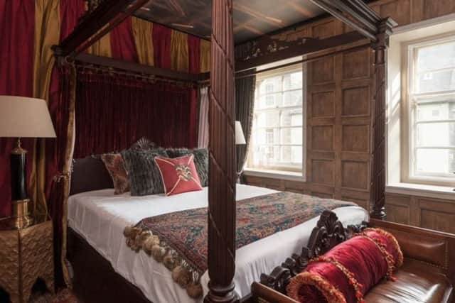 Picture: the master bedroom is themed on a Gryffindor dorm room , www.canongateluxuryapartment.co.uk/