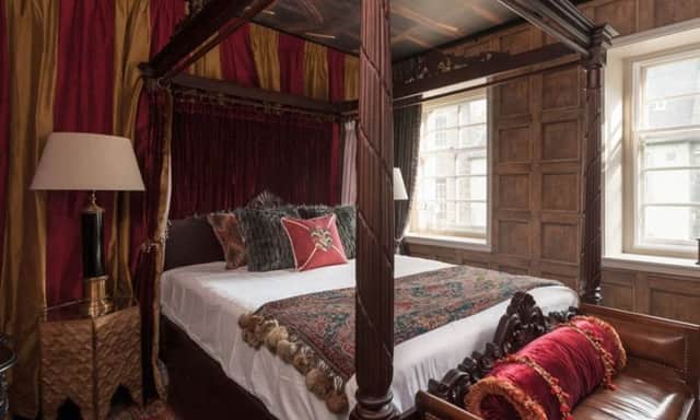 The flat's master bedroom is based on a Gryffindor dorm room