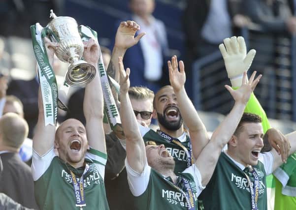 David Gray, left, lifts the Scottish Cup in 2016. Pic: SNS