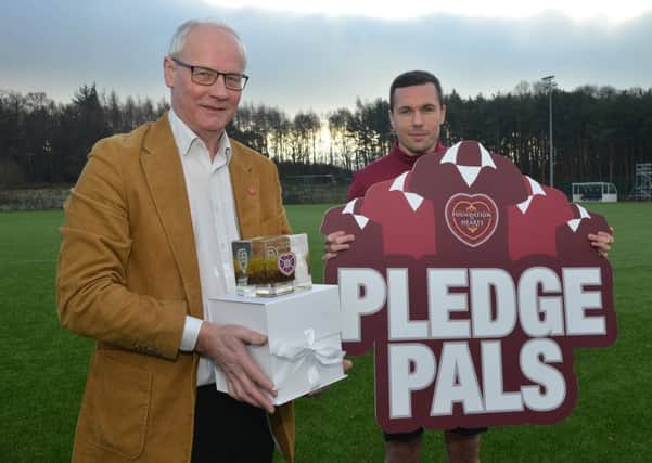 Hearts midfielder Don Cowie joined Foundation of Hearts director Alastair Bruce to promote Pledge Pals  a scheme to get FoH members to encourage friends to join. Pic: Jon Savage