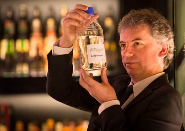 Prof Martin Tangney, founder of Celtic Renewables showing the first sample of bio-butanol at The Scotch Whisky Experience, Edinburgh. Picture: Centre Press
