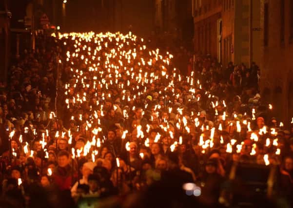 The torchlight procession makes for a spectacular start to the Capitals Hogmanay celebrations. Picture: Jon Savage
