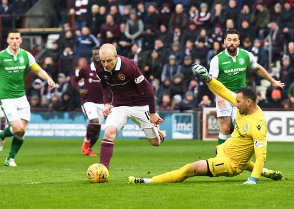 Steven Naismith rounds Ofir Marciano, but he could not put Hearts ahead early in the match. Pic: SNS