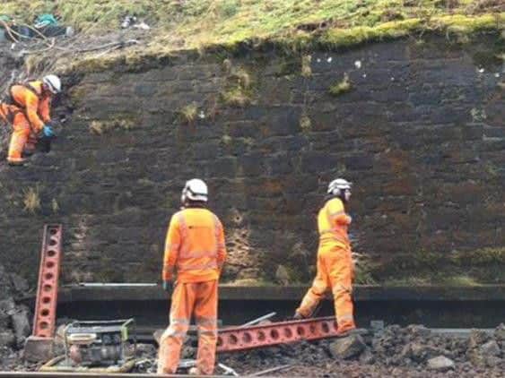 Repairs to the failed wall continuing today. Picture: ScotRail Alliance