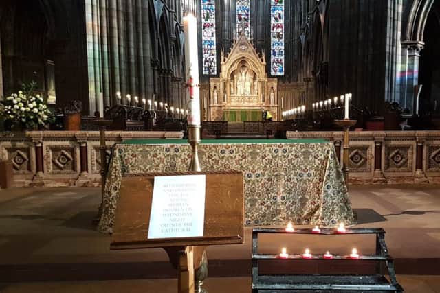 Candles in St Mary's Cathederal, Edinburgh, lit for a pregnant woman who was struck by a bus on the corner of Palmerston Place and Lansdowne Crescent