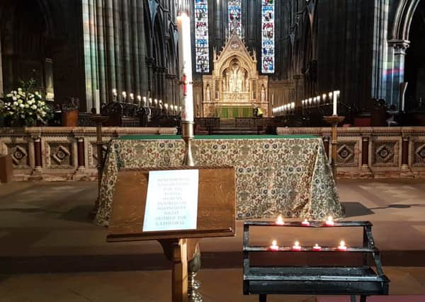 Candles in St Mary's Cathederal, Edinburgh, lit for a pregnant woman who was struck by a bus on the corner of Palmerston Place and Lansdowne Crescent