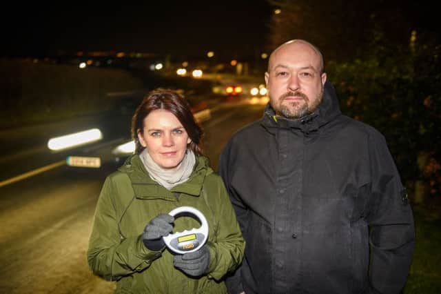 Carla Cross and local councillor Gordon Mackett  Elphinstone Road - so many cats have been run over and killed on this street, the residents have equipped themselves with hand held scanners - so that they can quickly identify whose pet is dead...