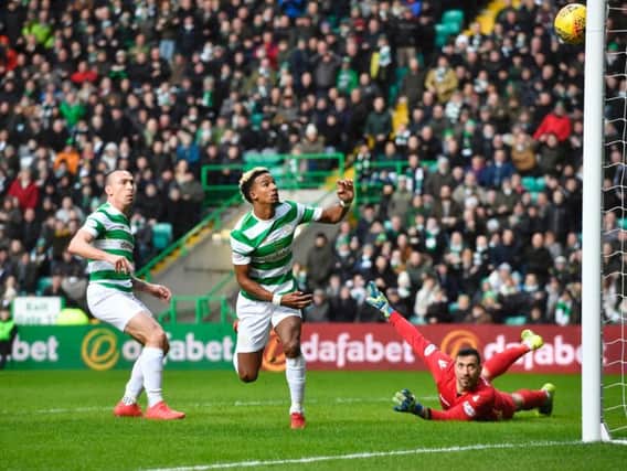 Celtic's Scott Sinclair can't believe it as he somehow manages to hit the bar of Hibs goalkeeper Ofir Marciano from only a few yards out.