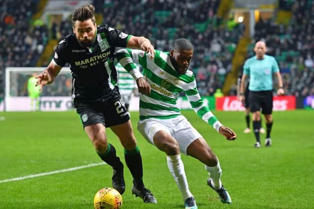 Darren McGregor challenges Celtic's Olivier Ntcham