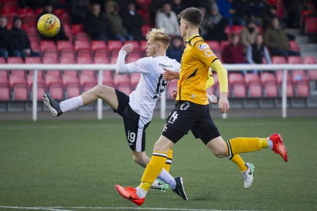 Scott Shepherd lobs home for Edinburgh Citys third. Pic: Ian Rutherford